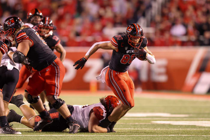 Utah Utes tight end Brant Kuithe (80) catches a pass and is brought down by San Diego State Aztecs defensive lineman Justus Tavai (91) in the second quarter at Rice-Eccles Stadium.